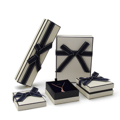 China Rectangle Fancy Jewelry Box With Ribbon Bow Customized Size And Logo supplier
