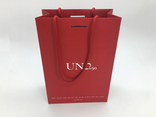 China Red Bottom Folding Branded Paper Bags With Cotton Rope , Silver Foil Logo supplier