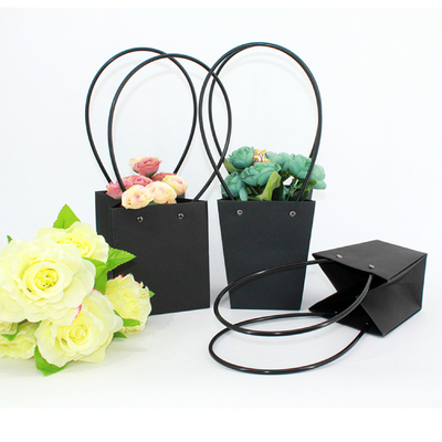 China Waterproof Flower Packaging Carry Kraft Paper Bag With Plastic Handle supplier